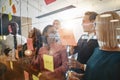 Diverse businesspeople laughing after a brainstorming session in Royalty Free Stock Photo