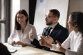 Diverse businesswomen laughing at colleague joke at corporate meeting Royalty Free Stock Photo