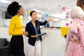 Diverse businesswomen talking and brainstorming in office