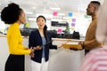 Diverse businesswomen talking and brainstorming in office