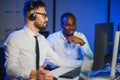 Diverse call center operators team use computers consulting clients in office Royalty Free Stock Photo