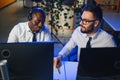 Diverse call center operators team use computers consulting clients in office Royalty Free Stock Photo
