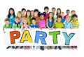 Diverse Cheerful Children Holding the Word Party Royalty Free Stock Photo