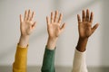 Diverse children raising hands in classroom, expressing eagerness to participate and engage in learning, unity in education, AI Royalty Free Stock Photo