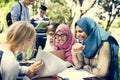 Diverse children studying outdoor together