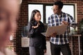 Diverse coders looking at security firewall on laptop Royalty Free Stock Photo