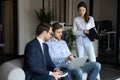 Diverse colleagues work together on laptop at casual meeting Royalty Free Stock Photo