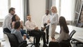 Diverse corporate team having coffee break at coworking room Royalty Free Stock Photo