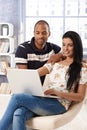 Diverse couple browsing internet at home Royalty Free Stock Photo