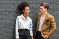 A Diverse couple - Multi-ethnic couple in love. African American woman and a Caucasian man standing background wall. Portrait of a Royalty Free Stock Photo