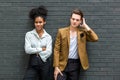 A Diverse couple - Multi-ethnic couple in love. African American woman and a Caucasian man standing background wall. Portrait of a Royalty Free Stock Photo