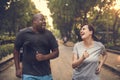 Diverse couple running at the park