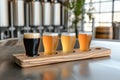 Diverse craft beer sampler on rustic wooden table in brewery setting Royalty Free Stock Photo