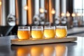 Diverse craft beer sampler on rustic wooden table in brewery setting Royalty Free Stock Photo