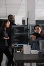 Diverse database developers discussing about html code on terminal window Royalty Free Stock Photo