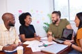 Diverse development team discusses code during code review meeting, programming Royalty Free Stock Photo