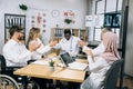 Diverse doctors clapping after speech of african colleague Royalty Free Stock Photo