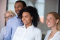 Diverse employees with African American leader posing in office Royalty Free Stock Photo