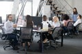 Busy multi racial office employees working in coworking shared room Royalty Free Stock Photo