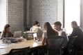 Diverse employees busy working in shared office