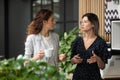 Diverse employees chatting during coffee break in modern office Royalty Free Stock Photo