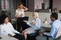 Diverse employees having pleasant conversation during coffee break Royalty Free Stock Photo