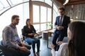 Diverse employees listen to team leader talking at meeting Royalty Free Stock Photo