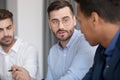 Diverse employees listening team leader at briefing meeting Royalty Free Stock Photo