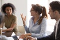 Diverse colleague brainstorm discussing ideas at briefing