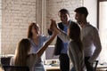 Diverse employees team giving high five, celebrating business success Royalty Free Stock Photo