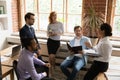 Diverse employees team listening to Indian mentor coach at meeting Royalty Free Stock Photo