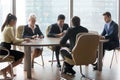 Diverse employees using gadgets during business office meeting Royalty Free Stock Photo