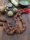 Diverse ethnic objects for meditation and relaxation: singing bowl, strike plates, drums, beads and two balls Royalty Free Stock Photo