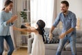 Diverse family playing hide and seek at home