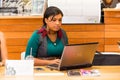 Diverse Female Customers using Internet in a Coffee Shop