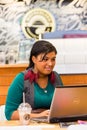 Diverse Female Customers using Internet in a Coffee Shop