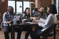 Diverse financial company employers sitting at desk while asian woman shaking job applicant hand at interview. Royalty Free Stock Photo