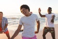 Diverse friends enjoy a beach outing