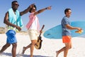 Diverse friends enjoy a sunny beach day Royalty Free Stock Photo