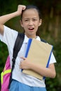 Diverse Girl Student And Confusion With School Books