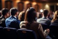 Diverse group backs of young people sitting outdoors man woman students listening speaker watching presentation Royalty Free Stock Photo