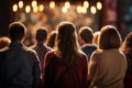 Diverse group backs of young people sitting outdoors man woman students listening speaker watching presentation Royalty Free Stock Photo