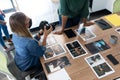 Diverse group of business colleagues wearing masks brainstorming holding camera in meeting room Royalty Free Stock Photo