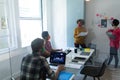 Diverse group of colleagues wearing face masks in office meeting Royalty Free Stock Photo