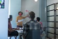 Diverse group of colleagues wearing masks in office meeting Royalty Free Stock Photo