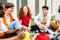 Diverse group of college students smile and having fun sitting at campus college Royalty Free Stock Photo