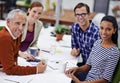 Diverse group, coworker and happy with teamwork for strategy on planning, project and ideas in office. Leader Royalty Free Stock Photo