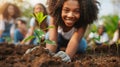 Diverse group of enthusiastic volunteers planting young trees together in urban park Royalty Free Stock Photo