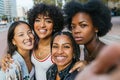 Diverse Group of female friends sharing a joyful moment together outdoors. Royalty Free Stock Photo