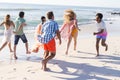 Diverse group of friends enjoy a beach outing